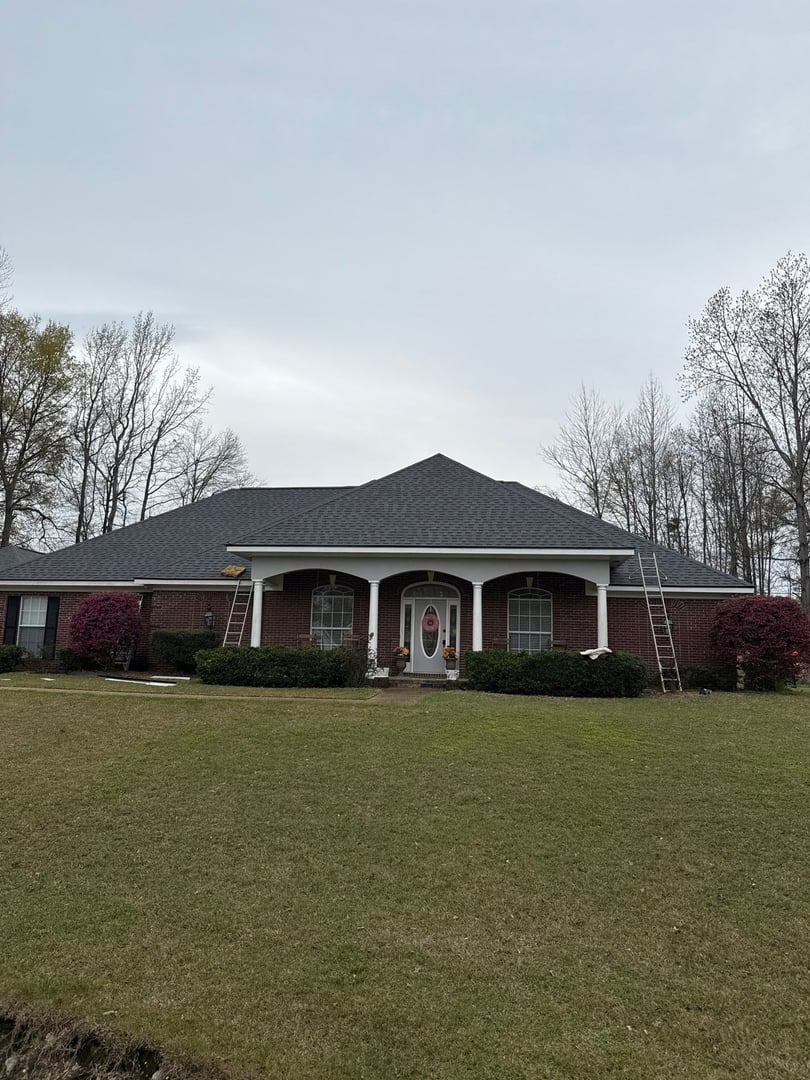 Professional roof inspector examining house roof