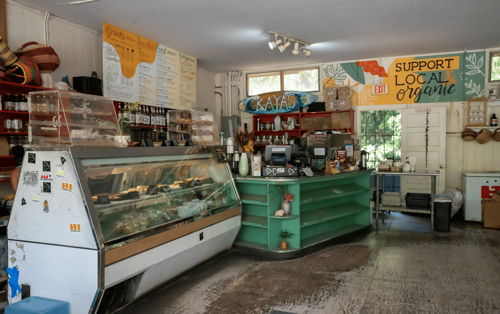 Artsy interior of Kaya's Coffee cafe with local artwork and organic Kona coffee in Kealakekua