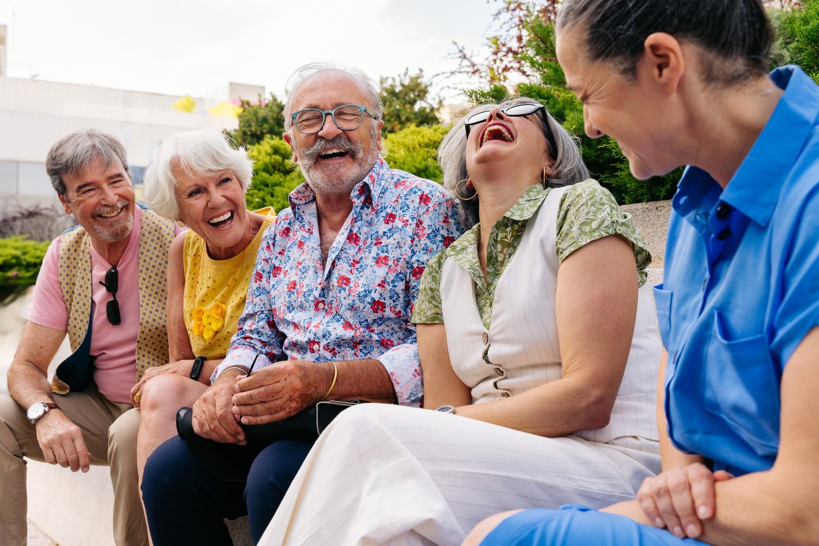 Group of senior friends meeting outdoors in the city and having fun - Cheerful old people bonding together, concepts about elderly, quality of life and aging lifestyle