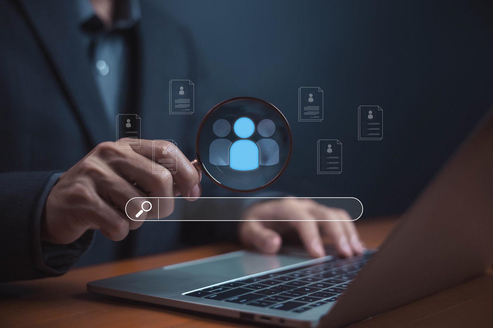Businessman analyzing customer data. a magnifying glass and a laptop, symbolizing recruitment, candidate search, customer insight, HR management, and digital talent acquisition. human resources