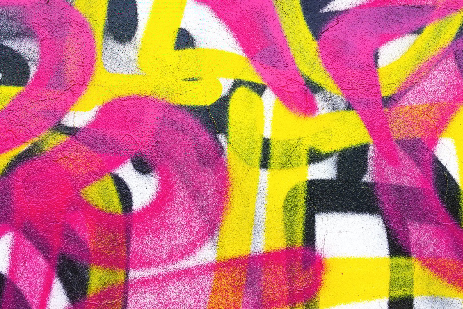 Graffiti street art in bright pink, yellow, black. Urban 90s, Y2K style, bold strokes, dynamic composition. Street murals, creative banners, youth culture visuals.