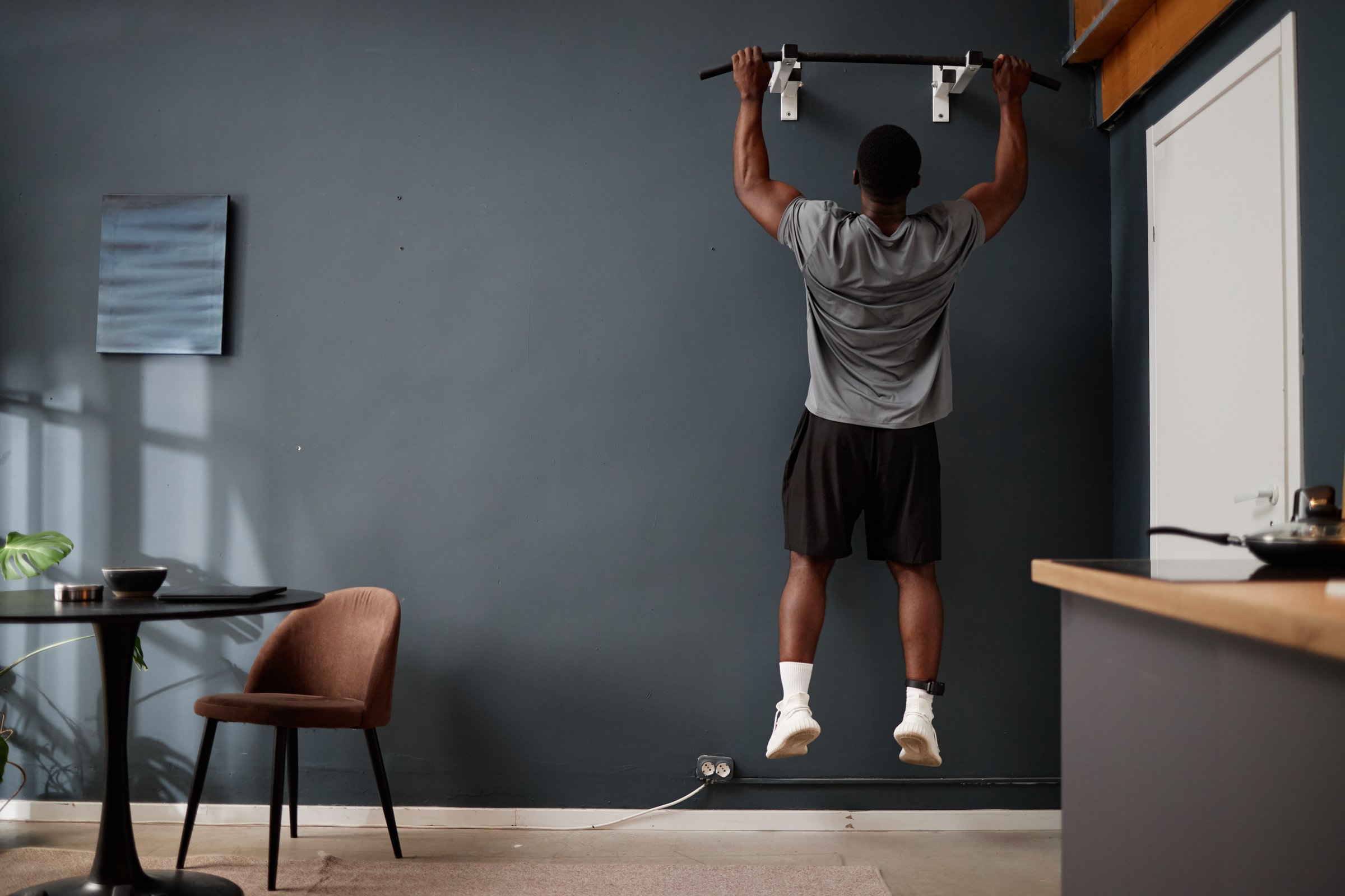 Man performing pull-up exercise