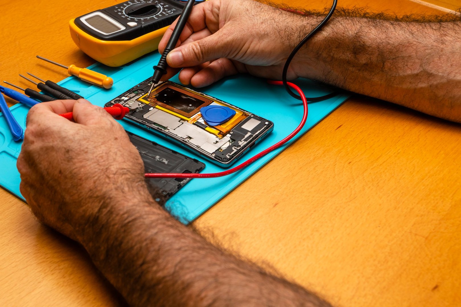 Close-up photos showing process of mobile phone repair iphone.