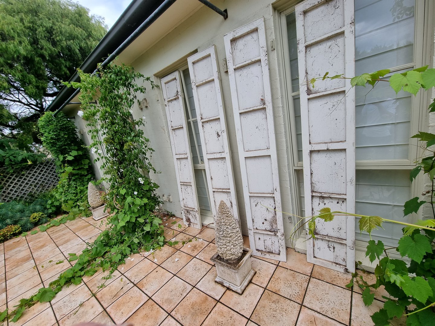 Estate exterior before Quality Painting Group transformation showing weathered surfaces requiring restoration