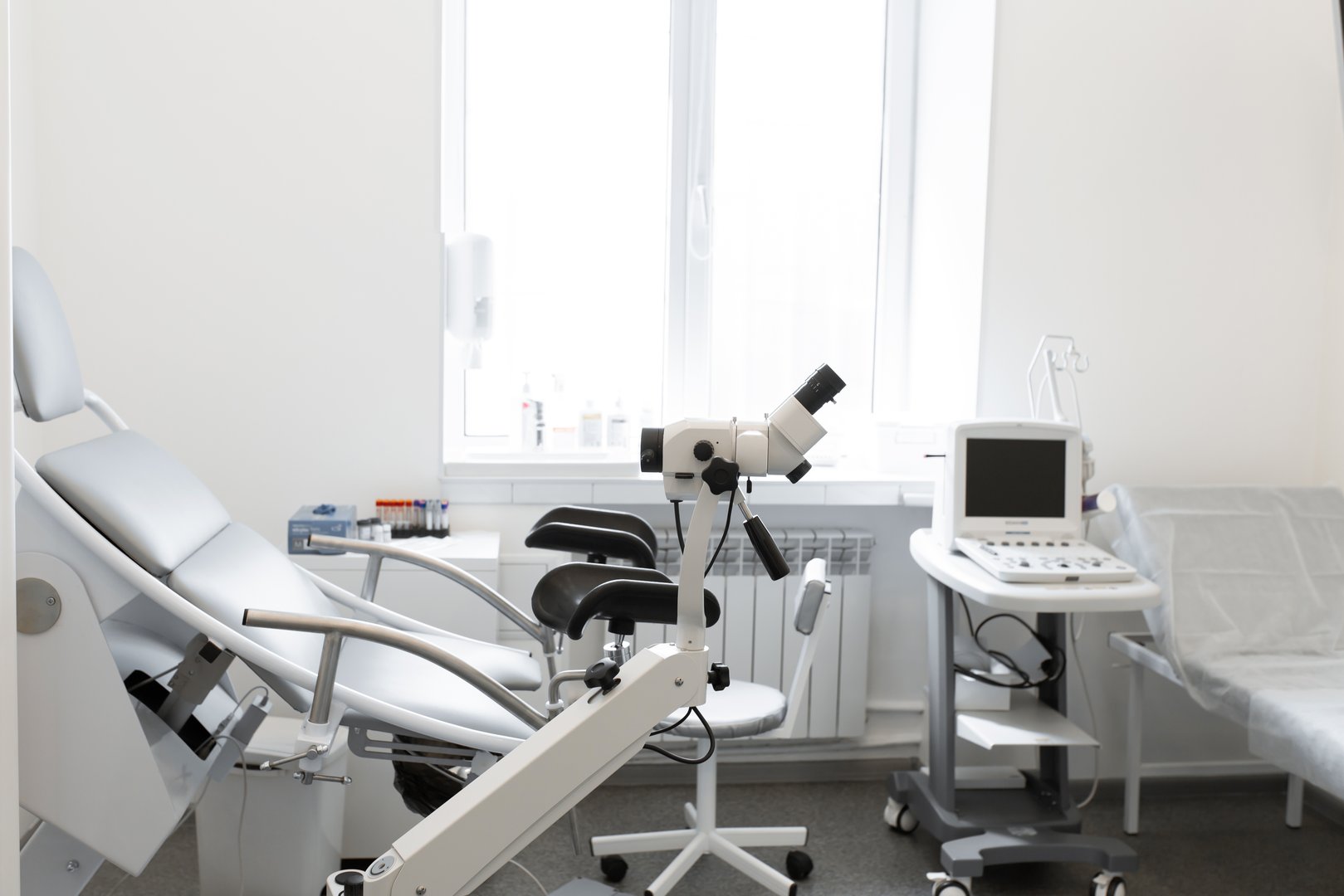 gynecological chair in a light gynecologist's office.