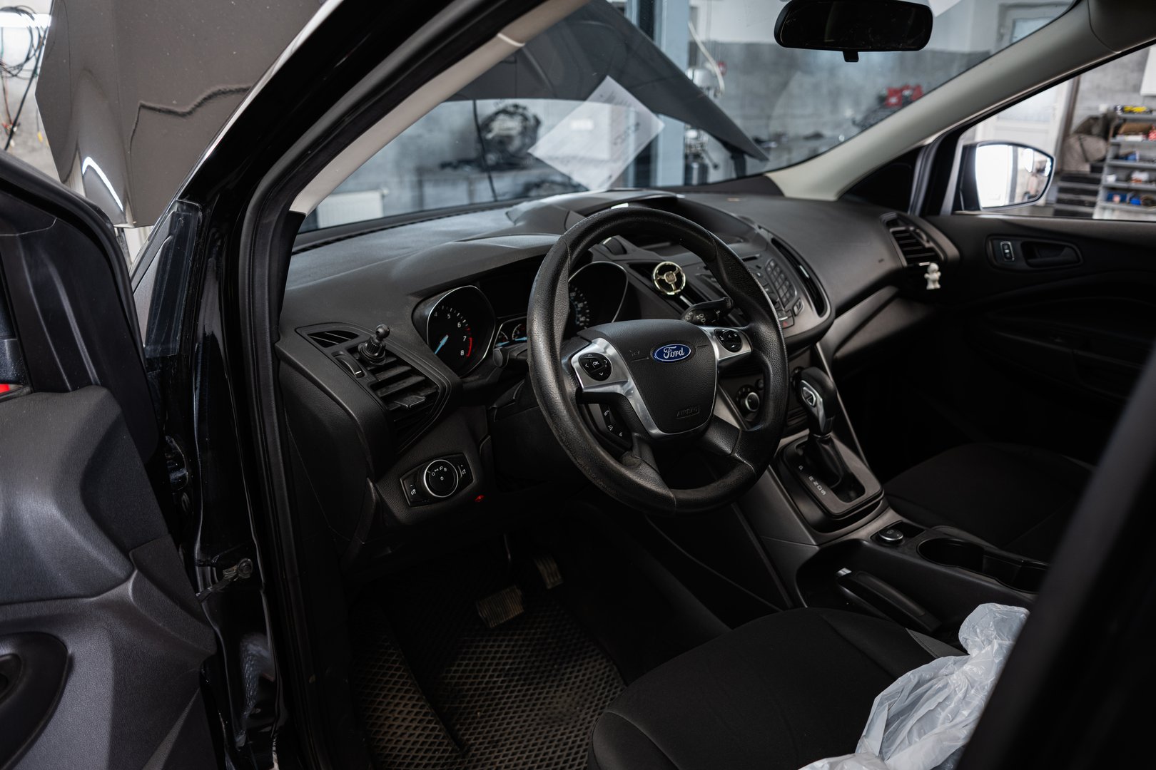Kyiv, Ukraine - June 10, 2025: Close-up view of Ford Escape car interior showcasing the dashboard and steering wheel