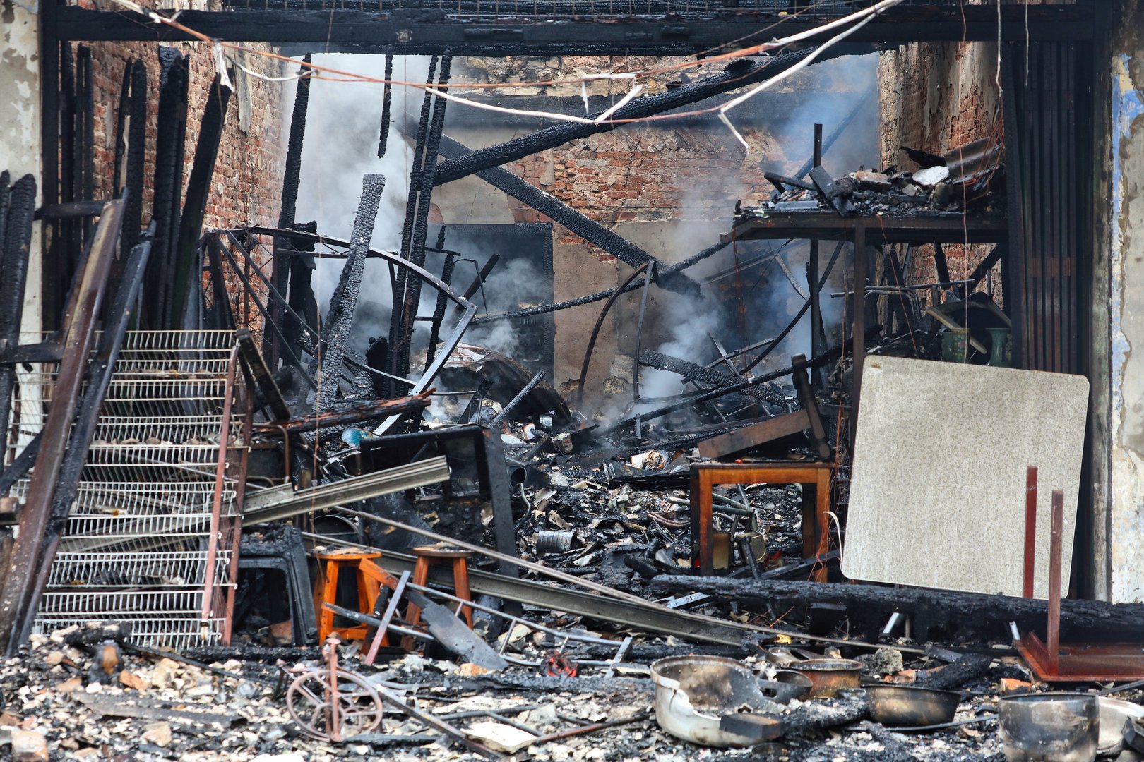 Restaurant interior smoldering after fire in Kuching city, Sarawak, Malaysia.