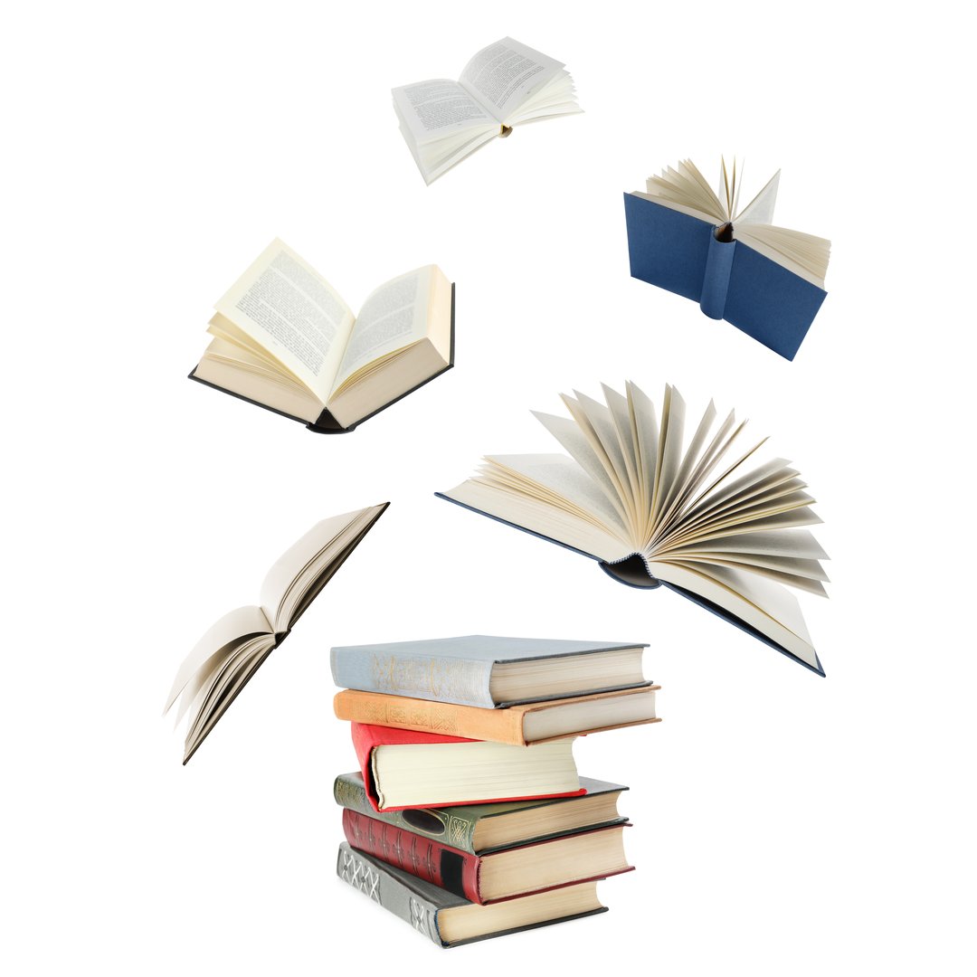 Books flying over stack on white background
