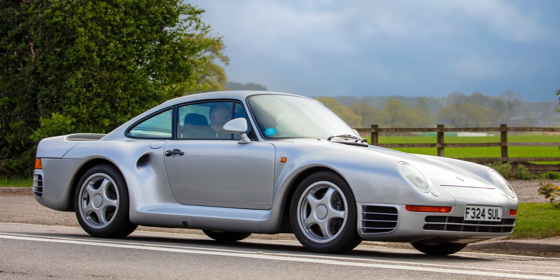 Bicester,Oxon,UK - April 24th 2022.  Silver 1989 Porsche 959 Coupe twin turbo  car on an English country road