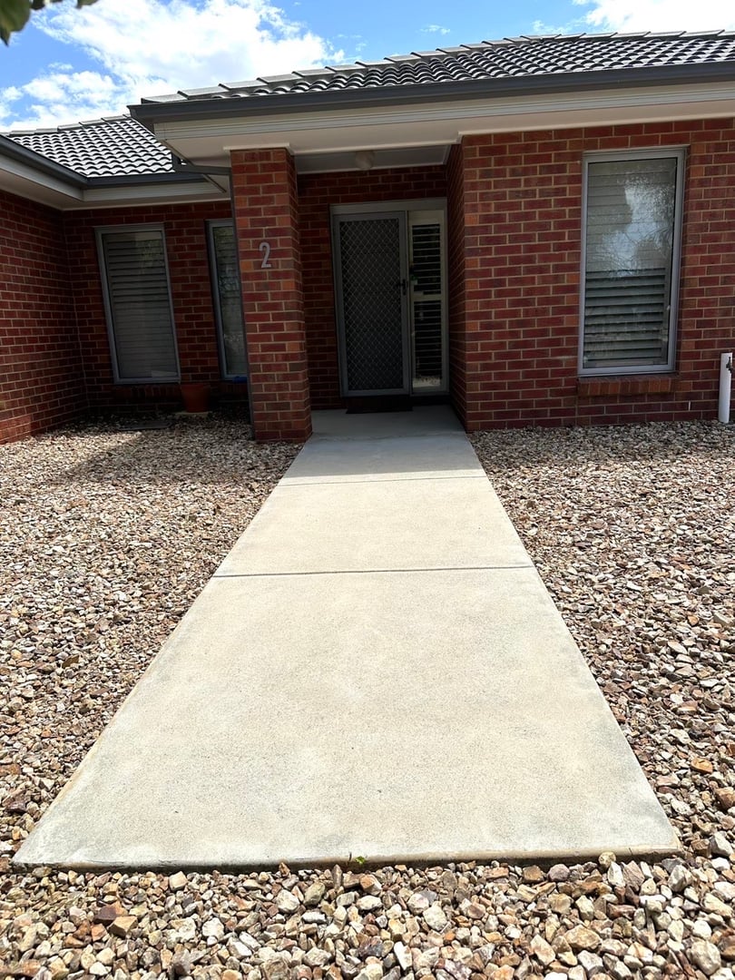 After - House exterior after cleaning