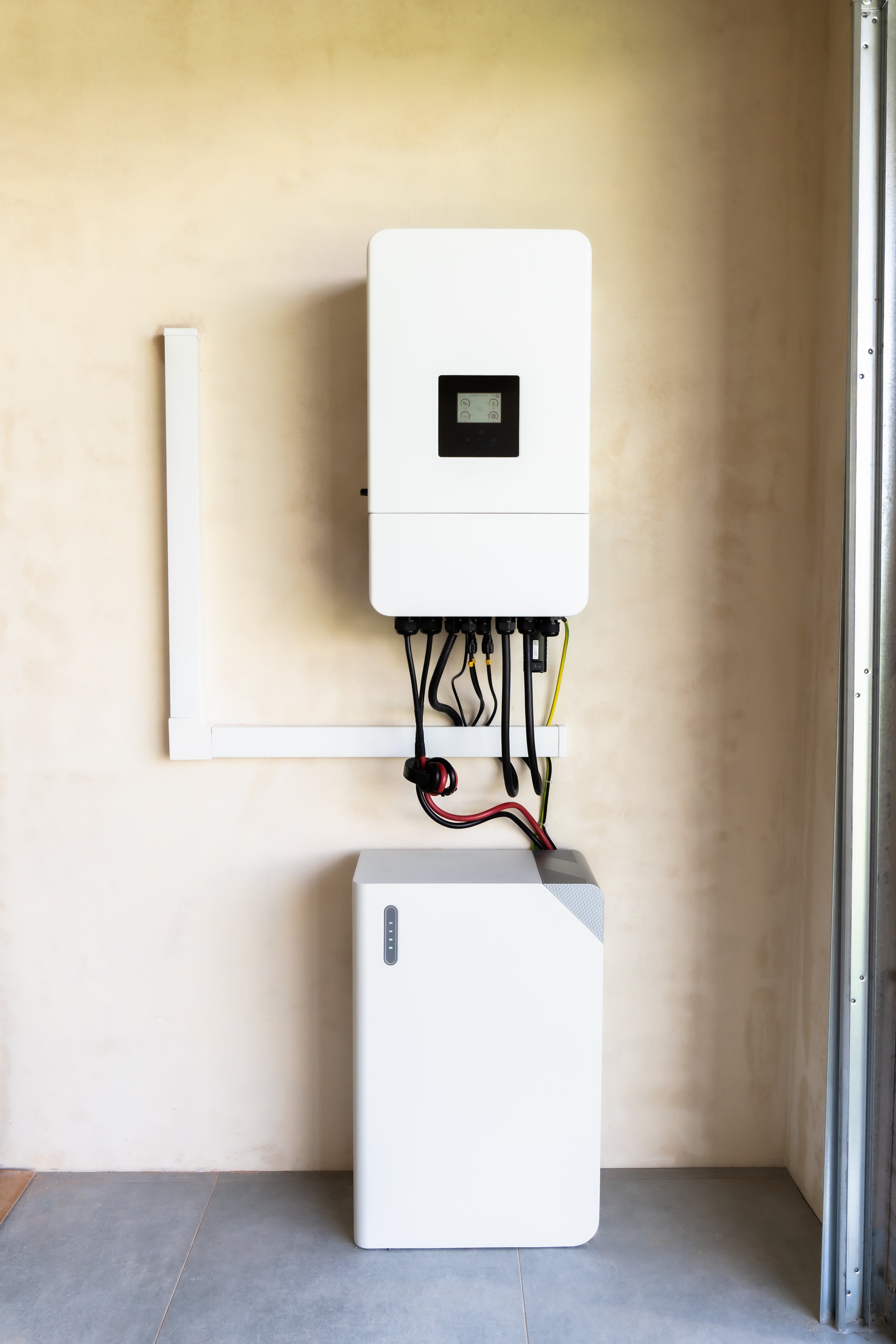 Modern solar inverter connected to a battery, part of a renewable energy system for storing and converting solar power efficiently.