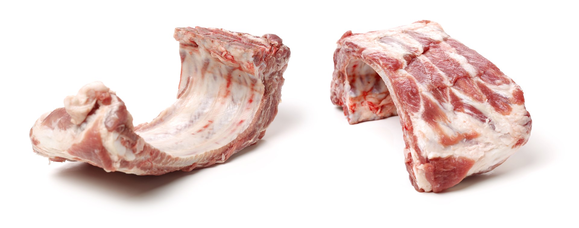 Raw spare ribs on white background