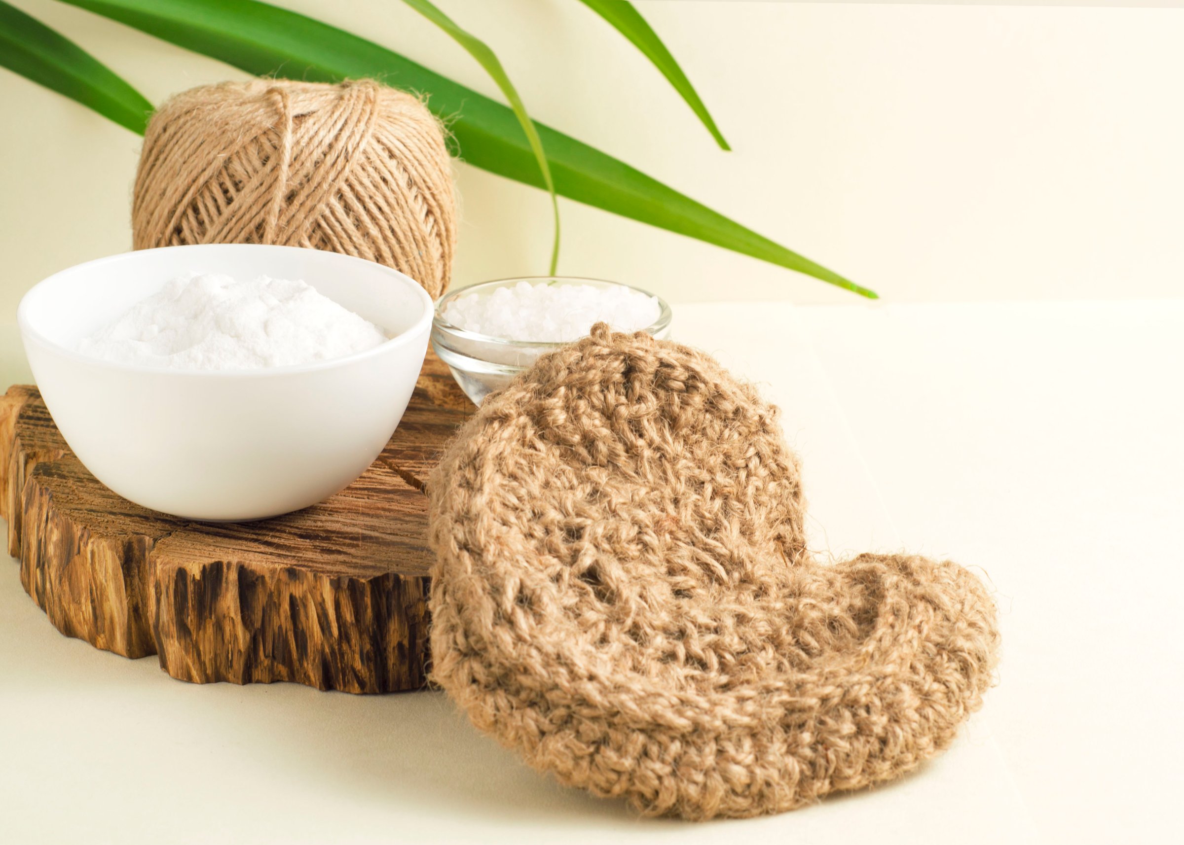 Natural jute sponge for washing dishes and natural cleaning products made of baking soda and salt. The concept of zero waste.