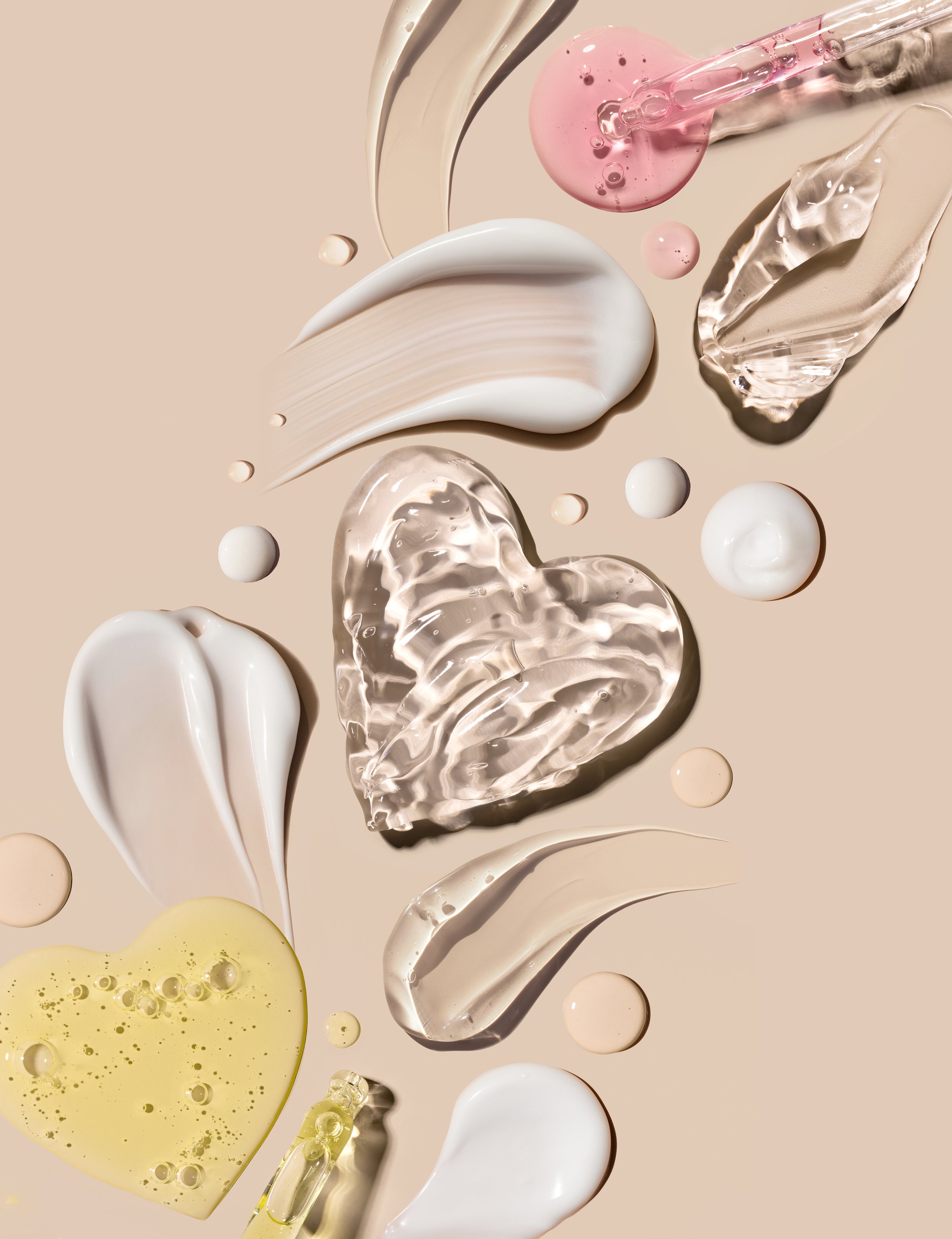 composition of smears of cream texture on a beige background