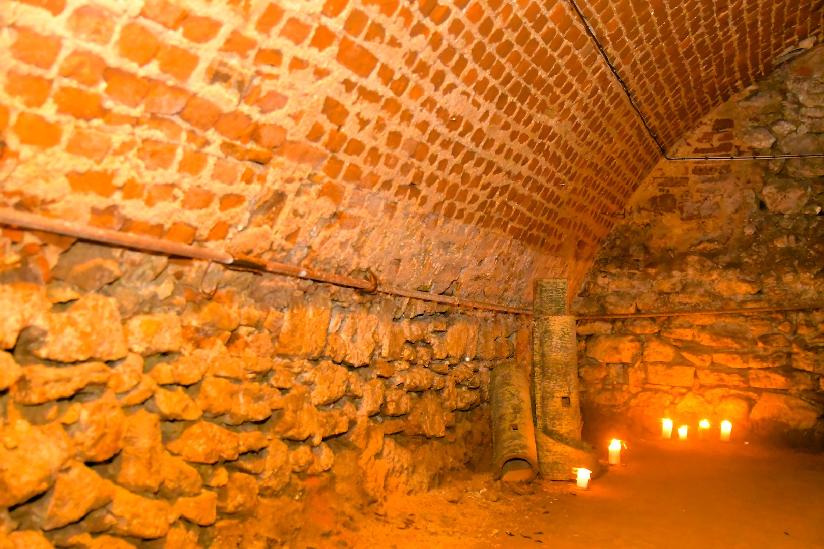A view of old corridors lit by candles. Old cellar spaces lit by candles. The concept of romance and old times.