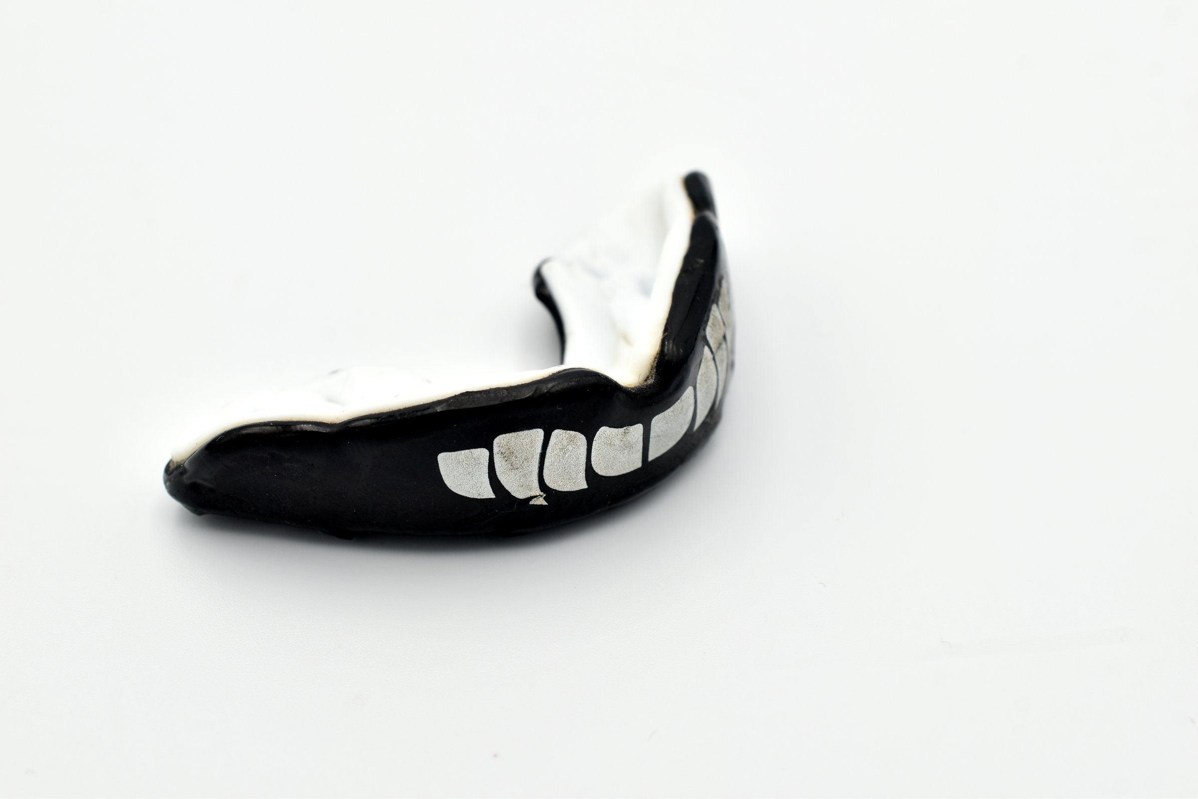 Mouth guard for protecting lips and teeth in a box