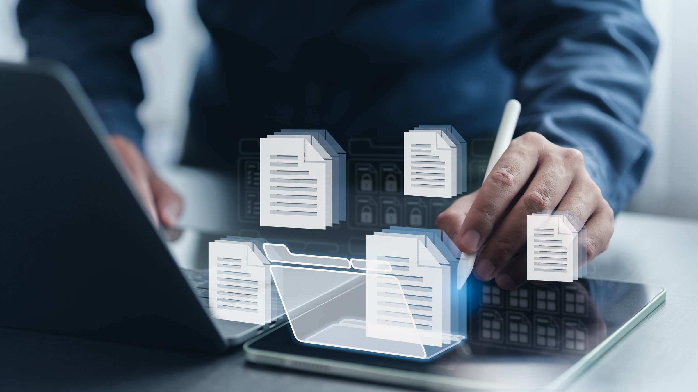 Digital document management and workflow system concept with businessman using laptop and tablet to access secure data, organize files, and streamline business processes.