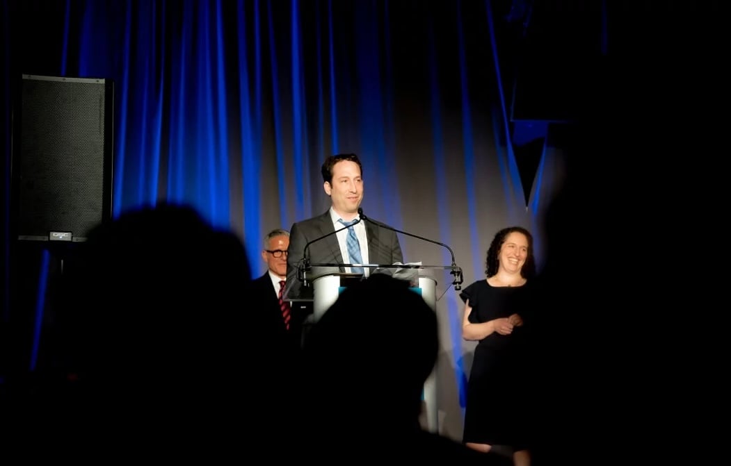 Business conference photography capturing keynote speaker presentation