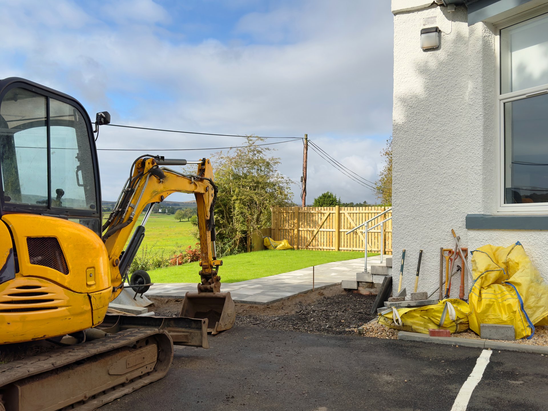Garden renovation works with new lawn and paving slabs UK