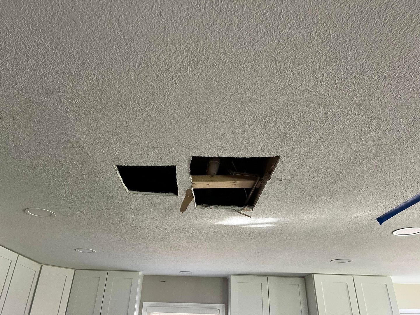 Shower leak damage showing rotted subfloor and framing in Toledo home