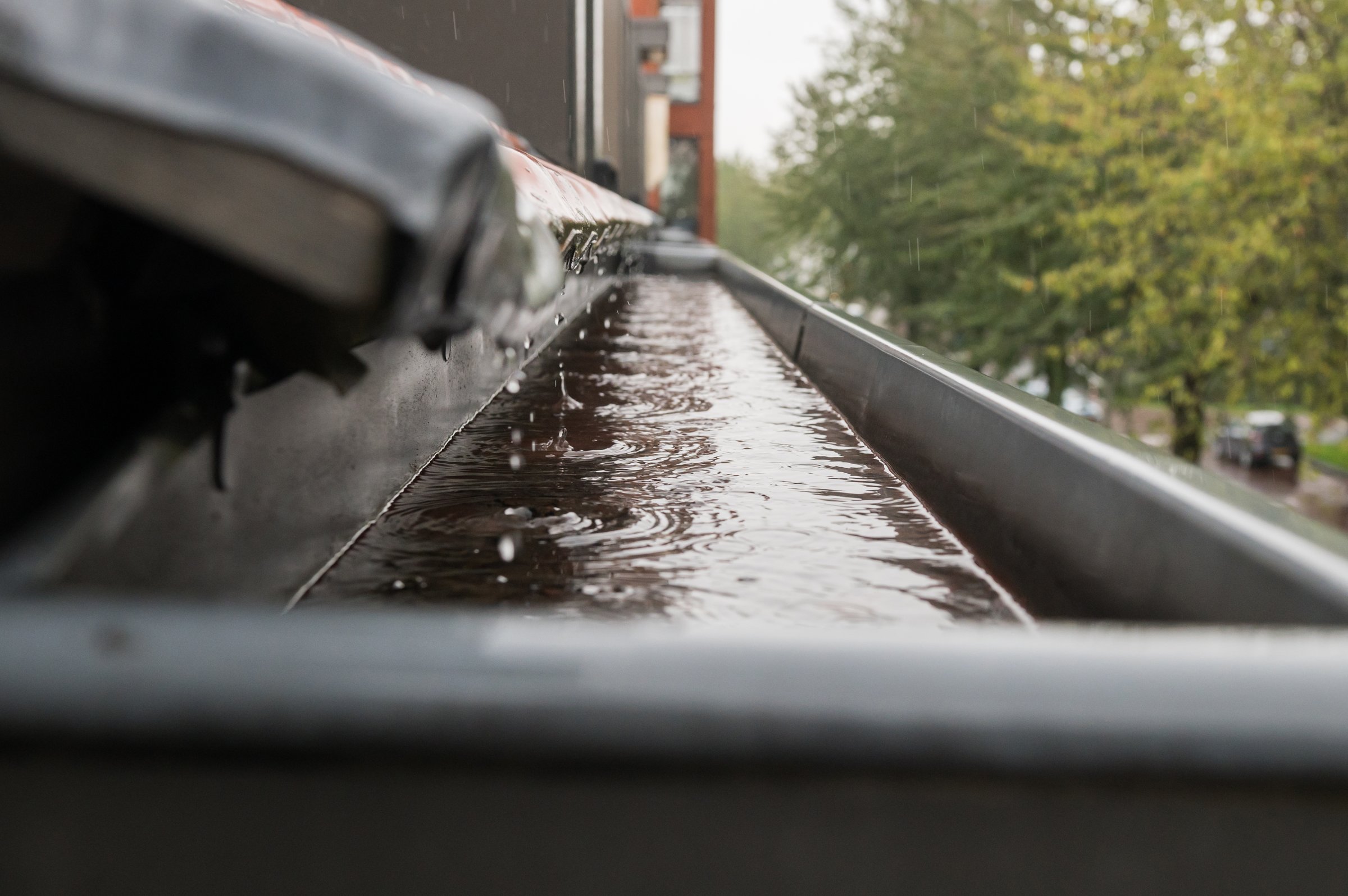 Water from the roof drains into the drain chute, rainy weather
