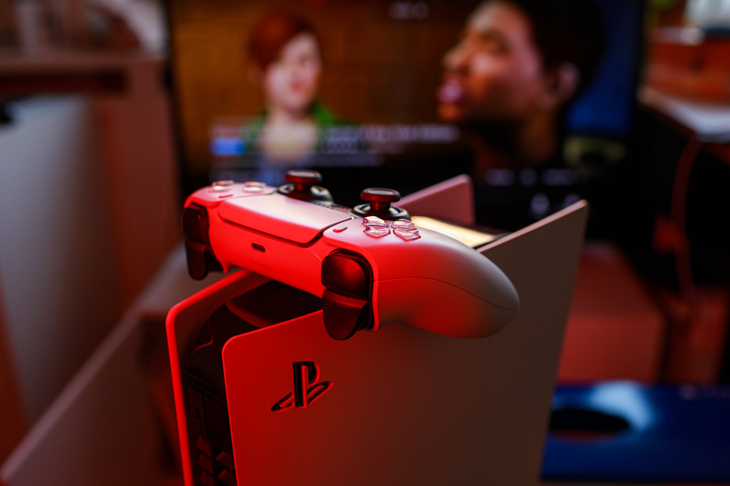 Riga, Latvia - November 23 2020: Sony PlayStation 5 game console on red background.