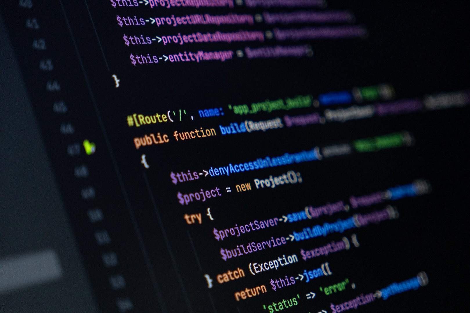 close-up of computer screen with colorful php code, focus on route and function keywords, backend development and programming