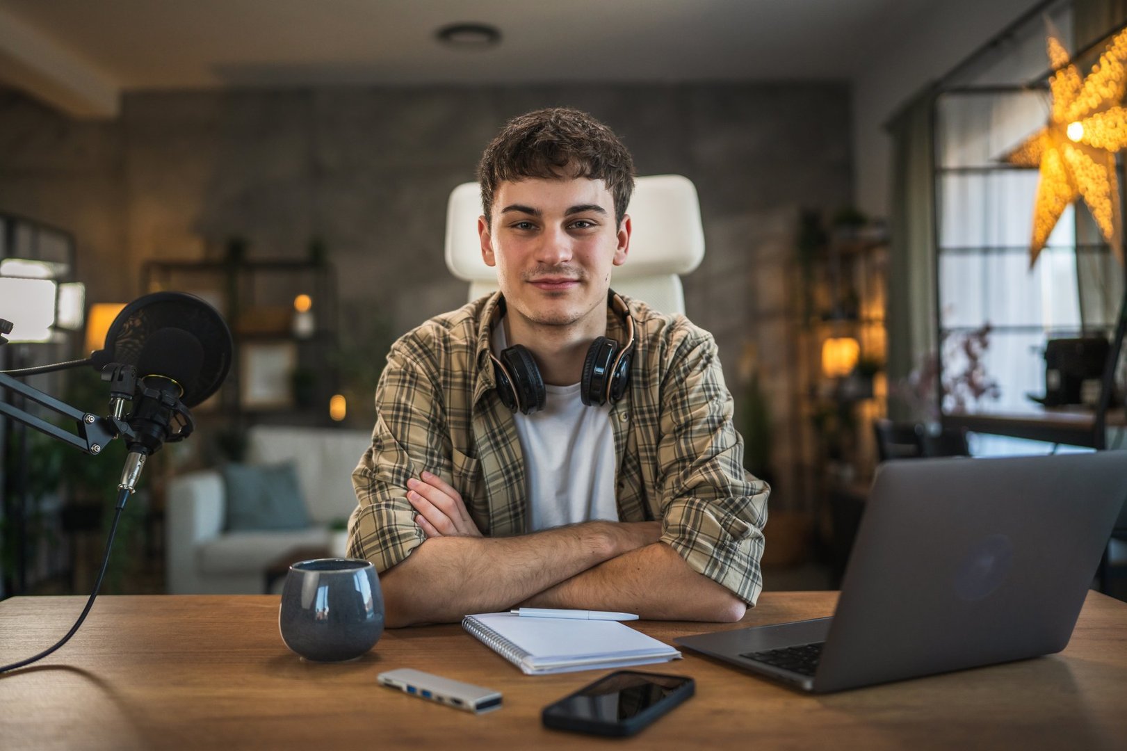 Portrait of young man blogger ready for record video blog or v-log at home studio