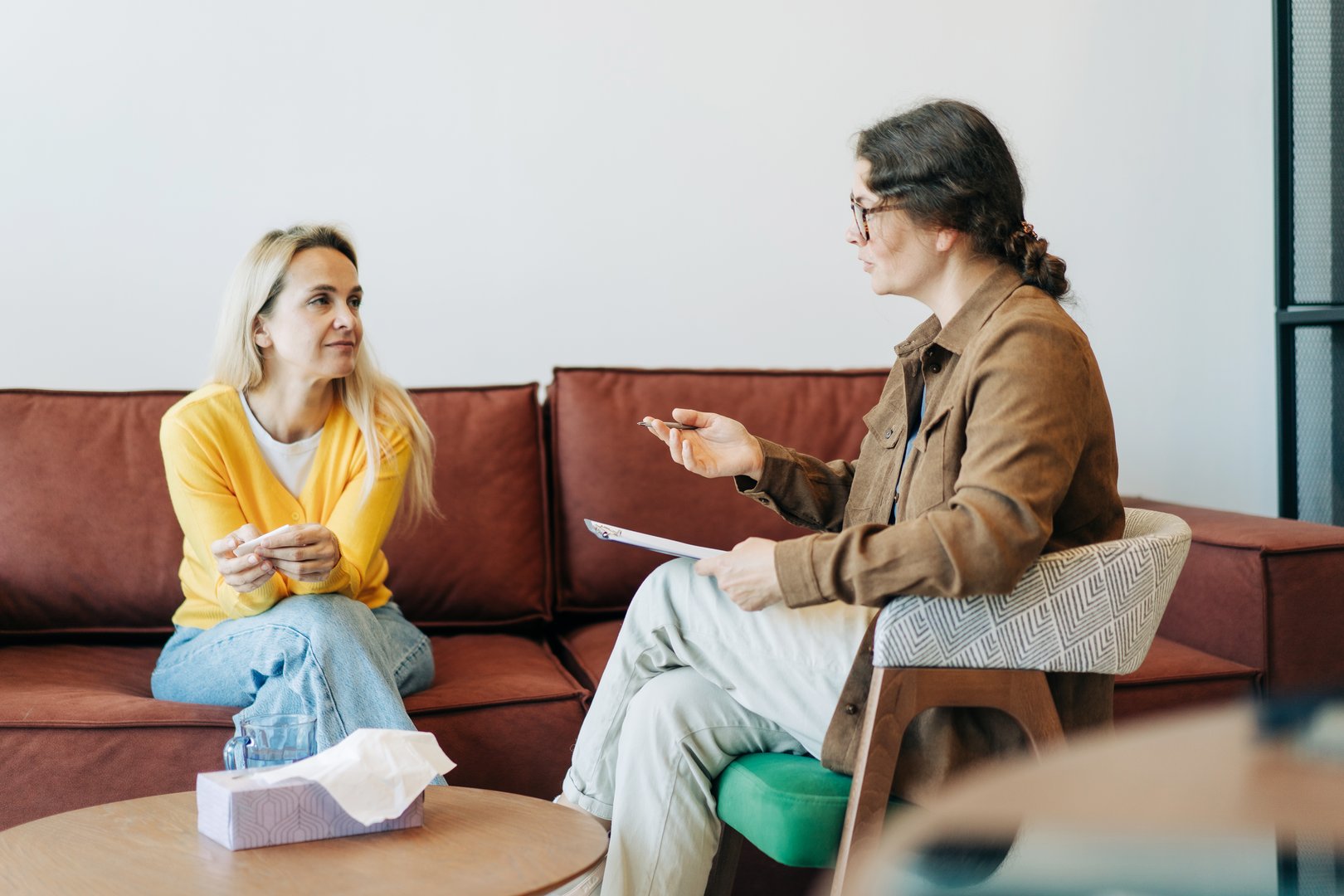 Psychological counseling scene.  A psychologist conducts a session with a patient in the office.