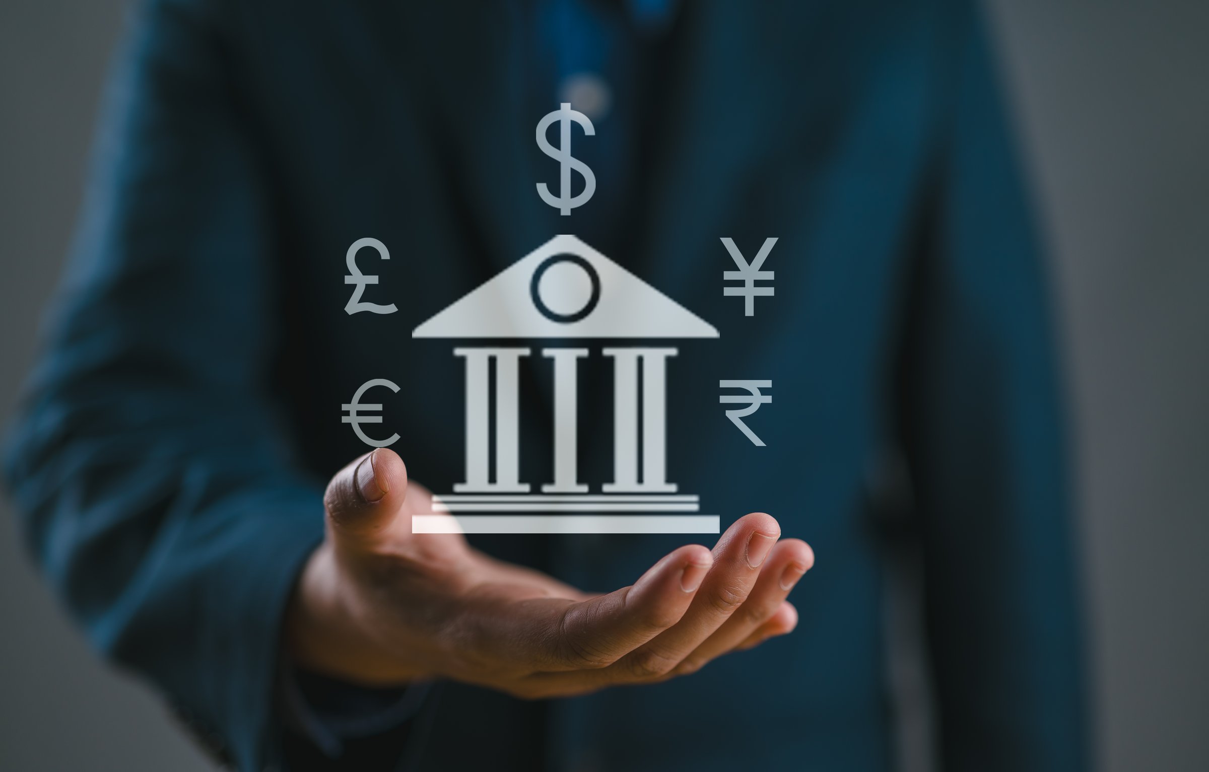 Businessman hands with bank, government, capital gain, transactions and exchange current bank finance concept.