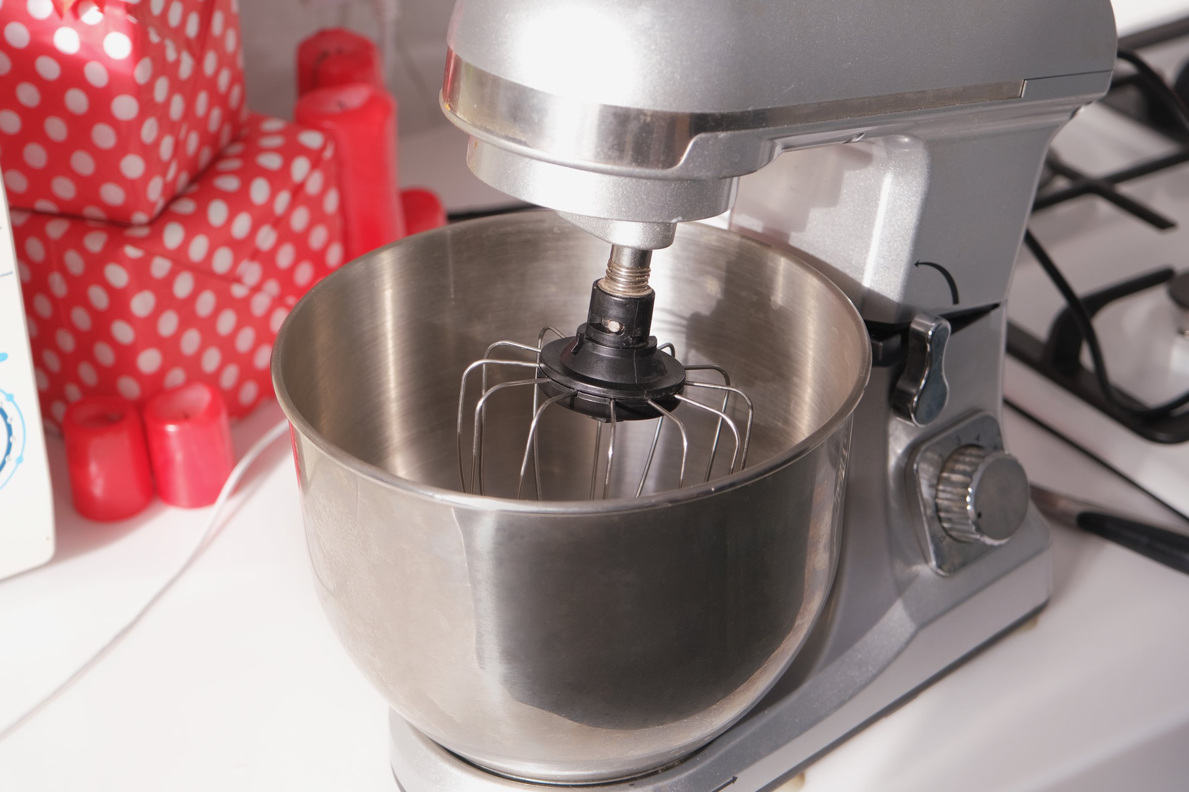 metallic stand mixer in the kitchen on the counter , cooking cookies for valentines day