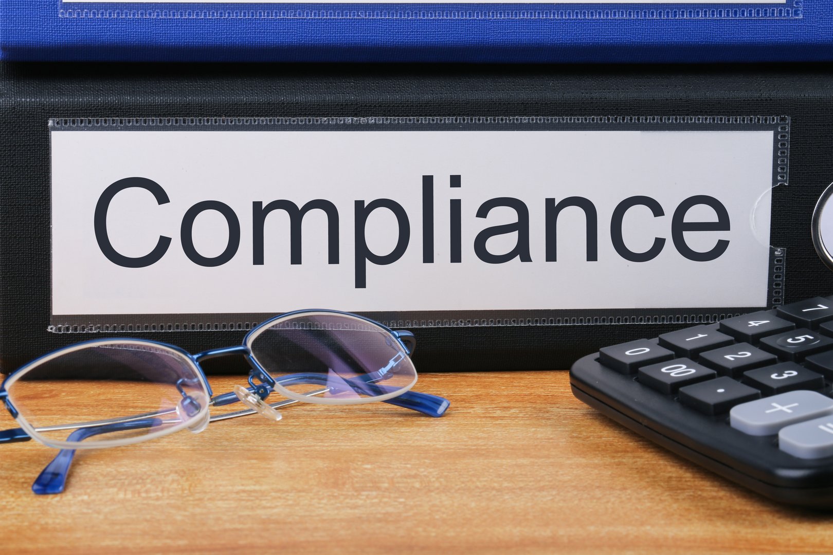 Compliance concept with word on folder.