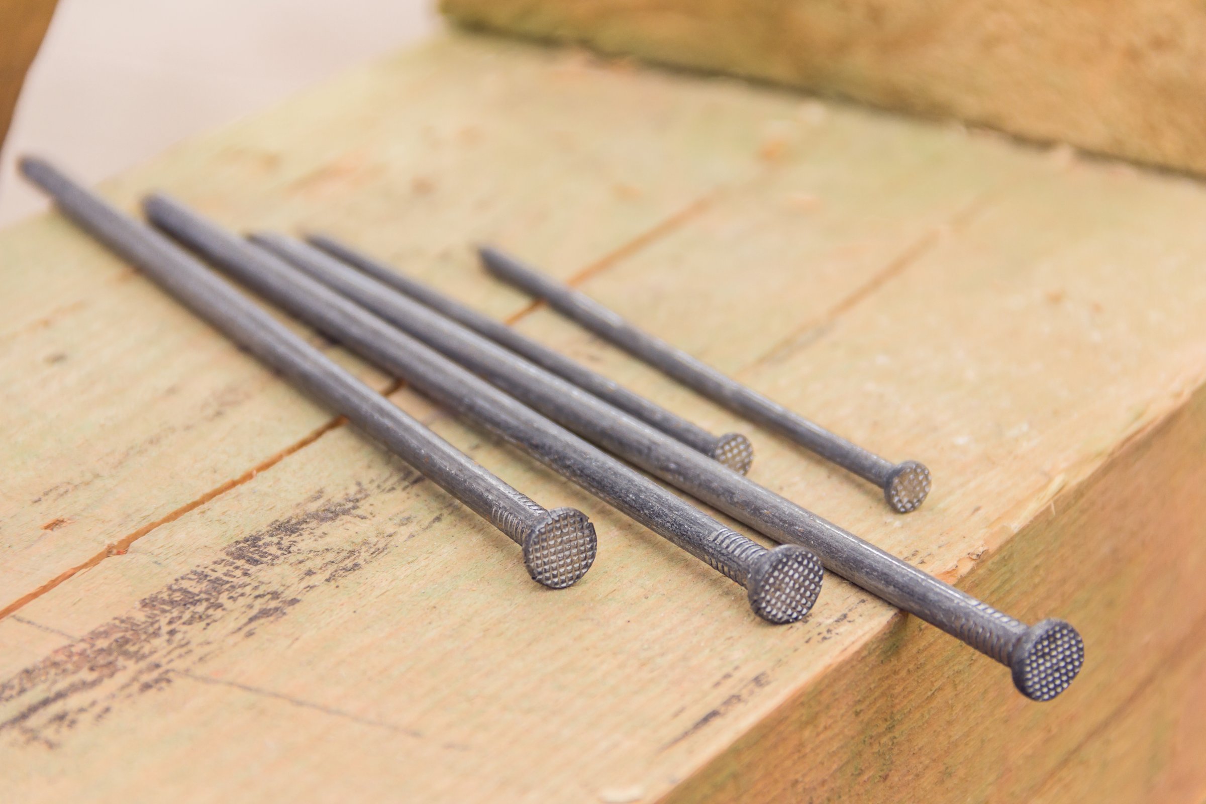 Construction nails during the construction of a wooden house. Building accessories nails