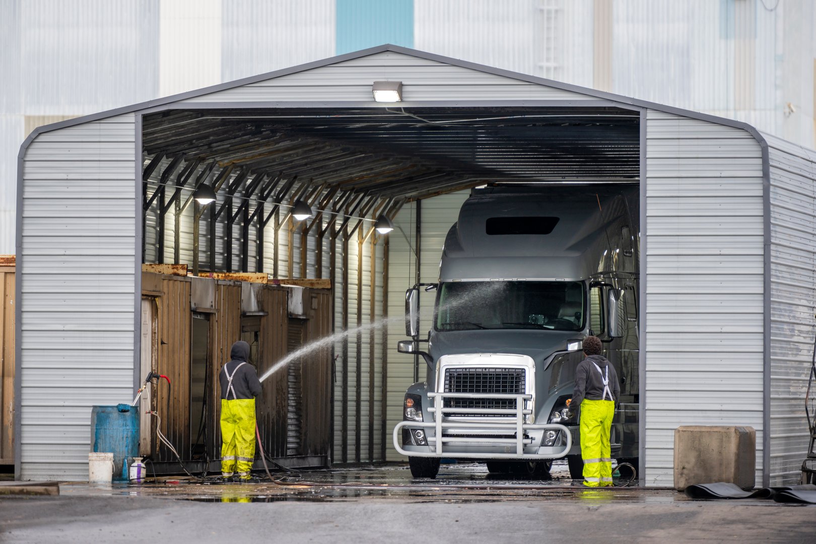 Manual washing station for large semi trucks with trailers located in a specially equipped industrial building to ensure the sanitary - technical norms of the movement of commercial vehicles
