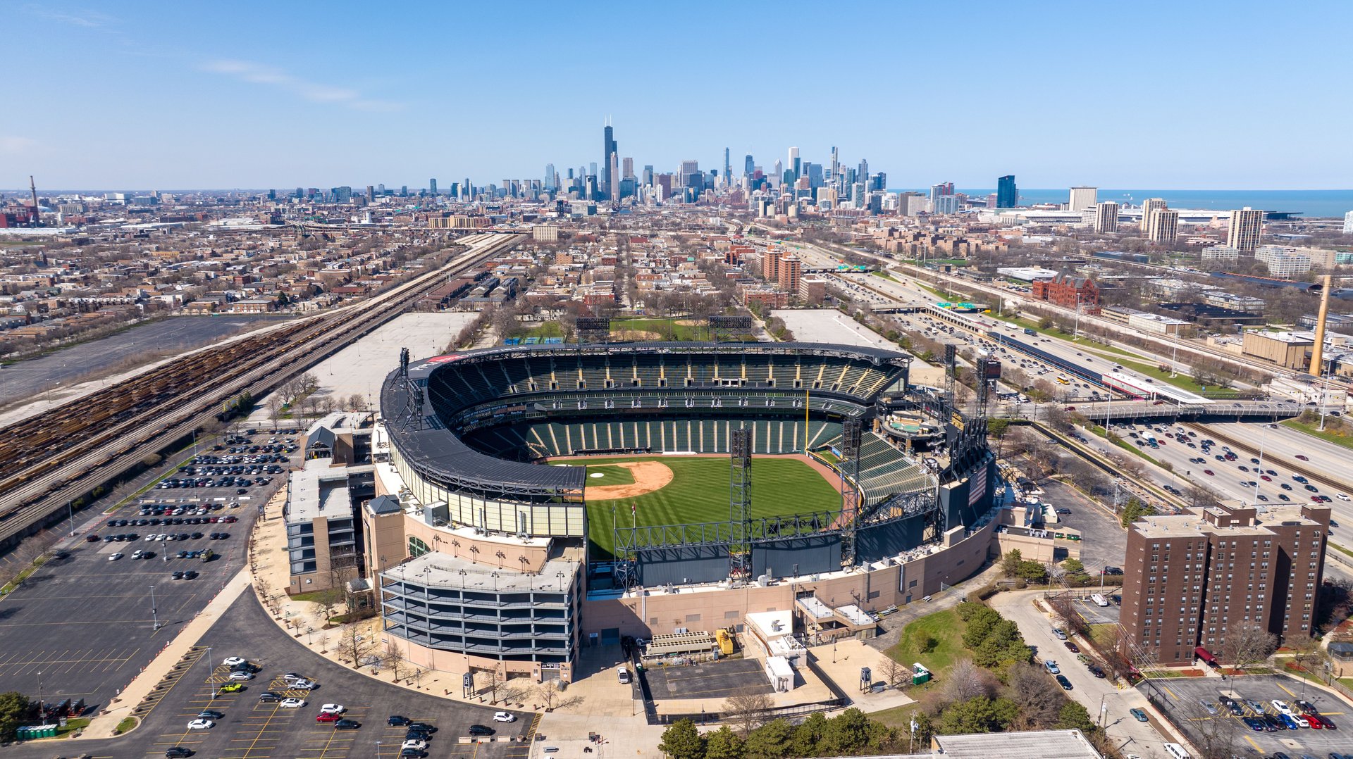 Chicago, United States – May 17, 2025: Aerial shot of White Sox ballpark with Chicago city backdrop.