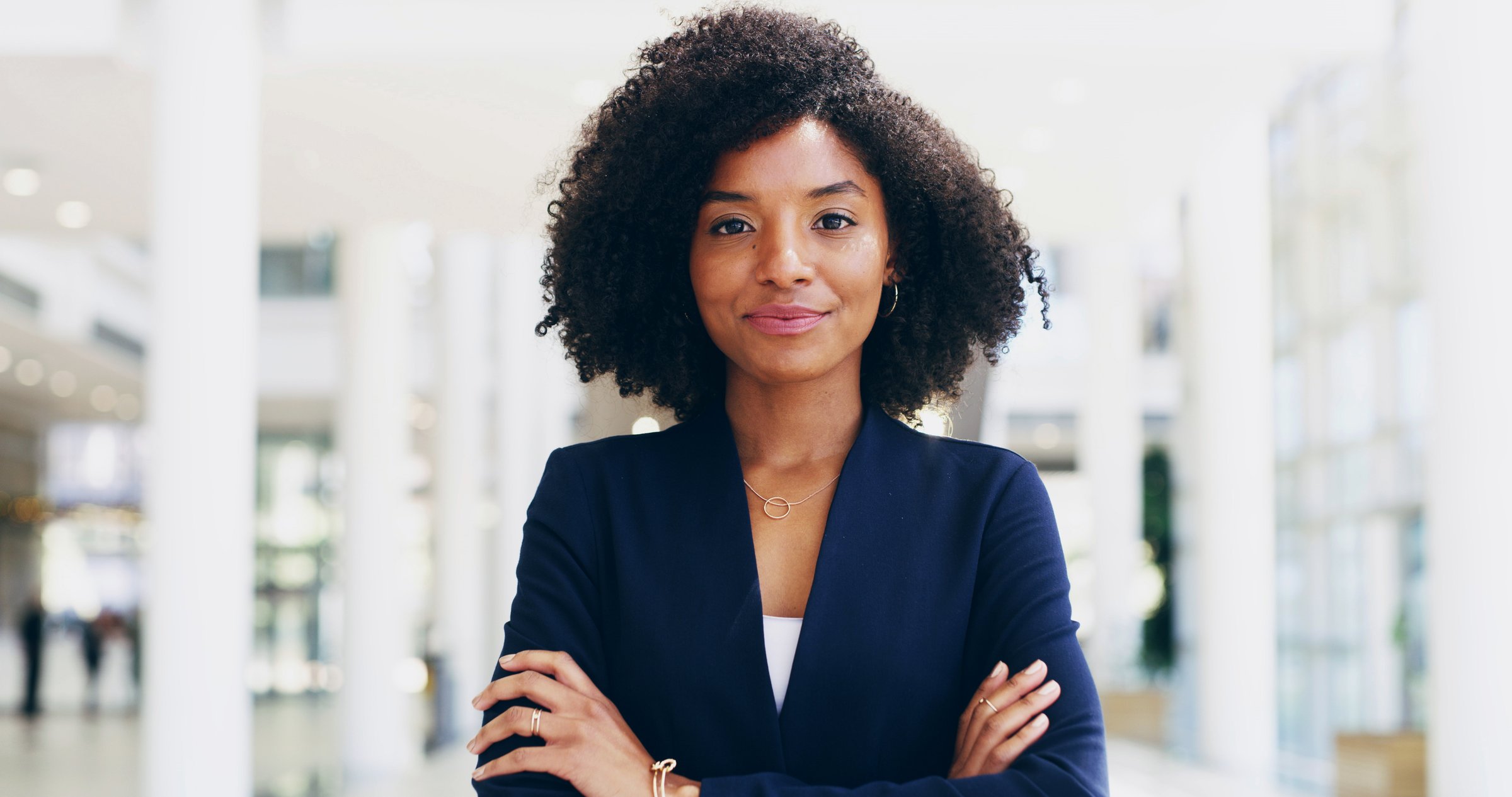 Portrait, lawyer or black woman in office with arms crossed for advocate, confidence or practice. Proud, legal counsel or attorney clerk at law firm for career growth, litigation or justice