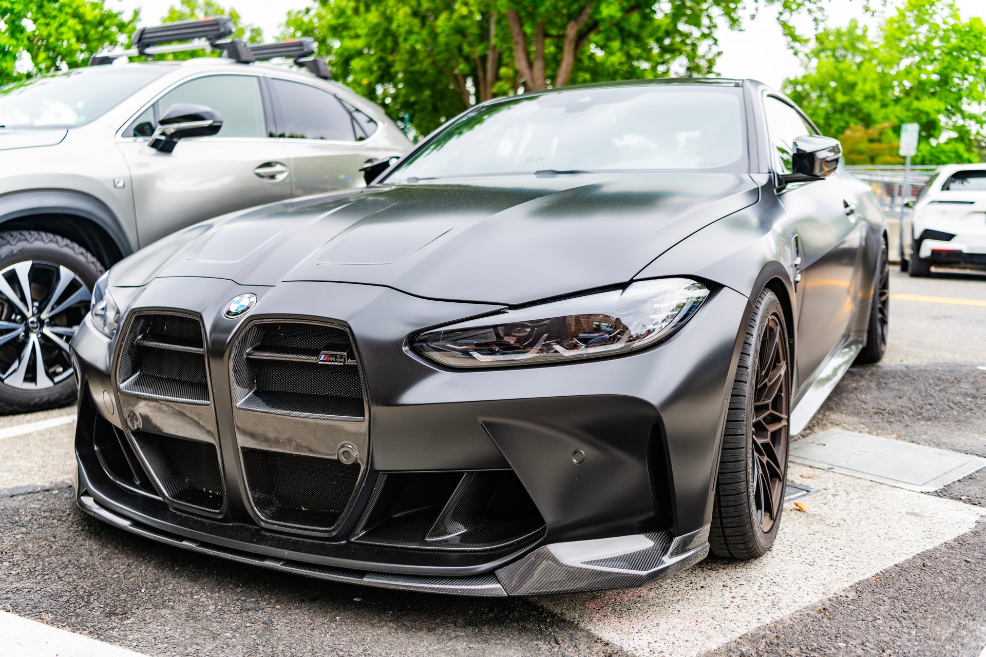 Seattle, WA, USA -July 22, 2024: Matte Black BMW M4 Competition. BMW, is a German multinational manufacturer of luxury vehicles and motorcycles. BMW is a prestige car. front view