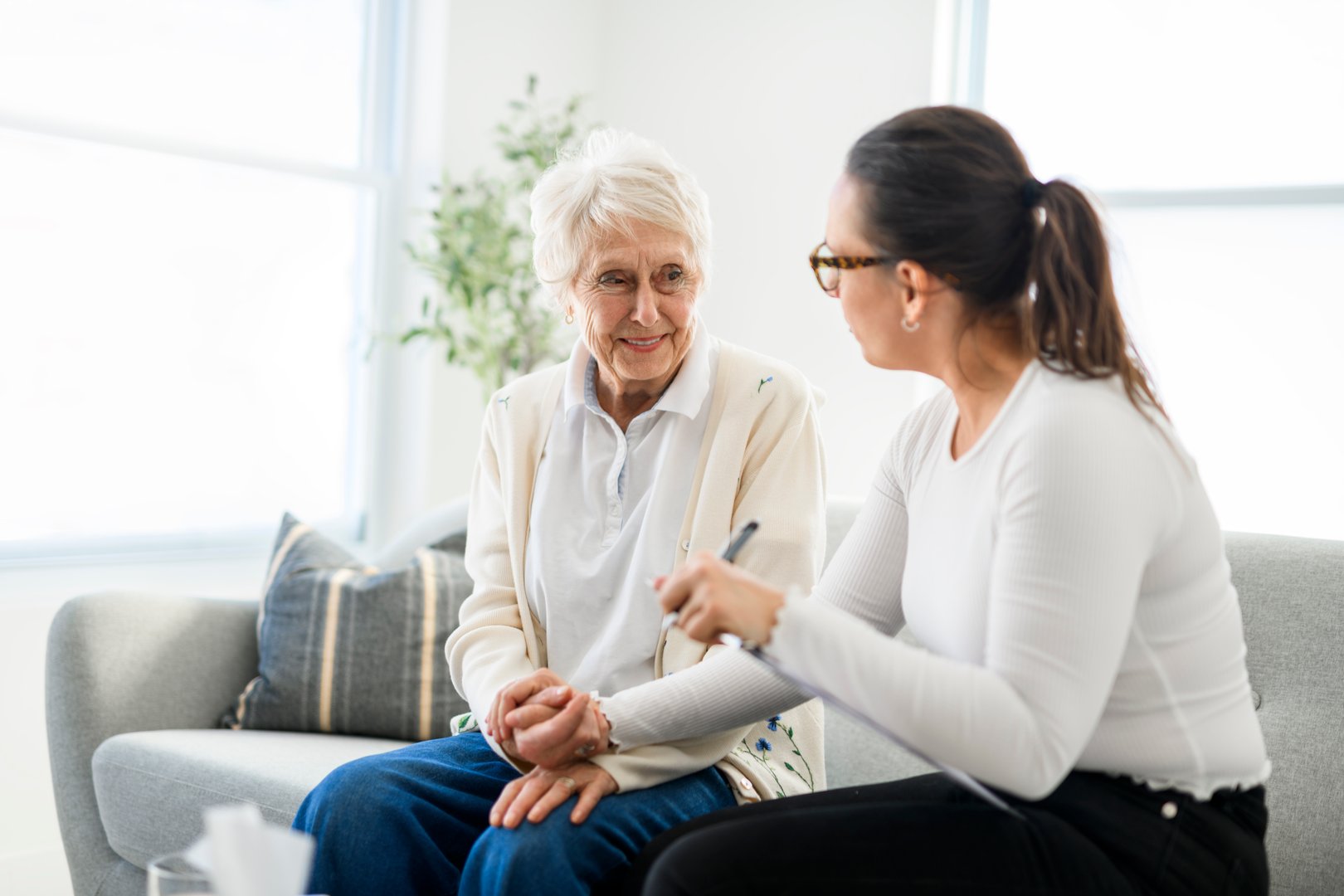 A old woman thinking with psychologist in consultation office for mind, evaluation or assessment.