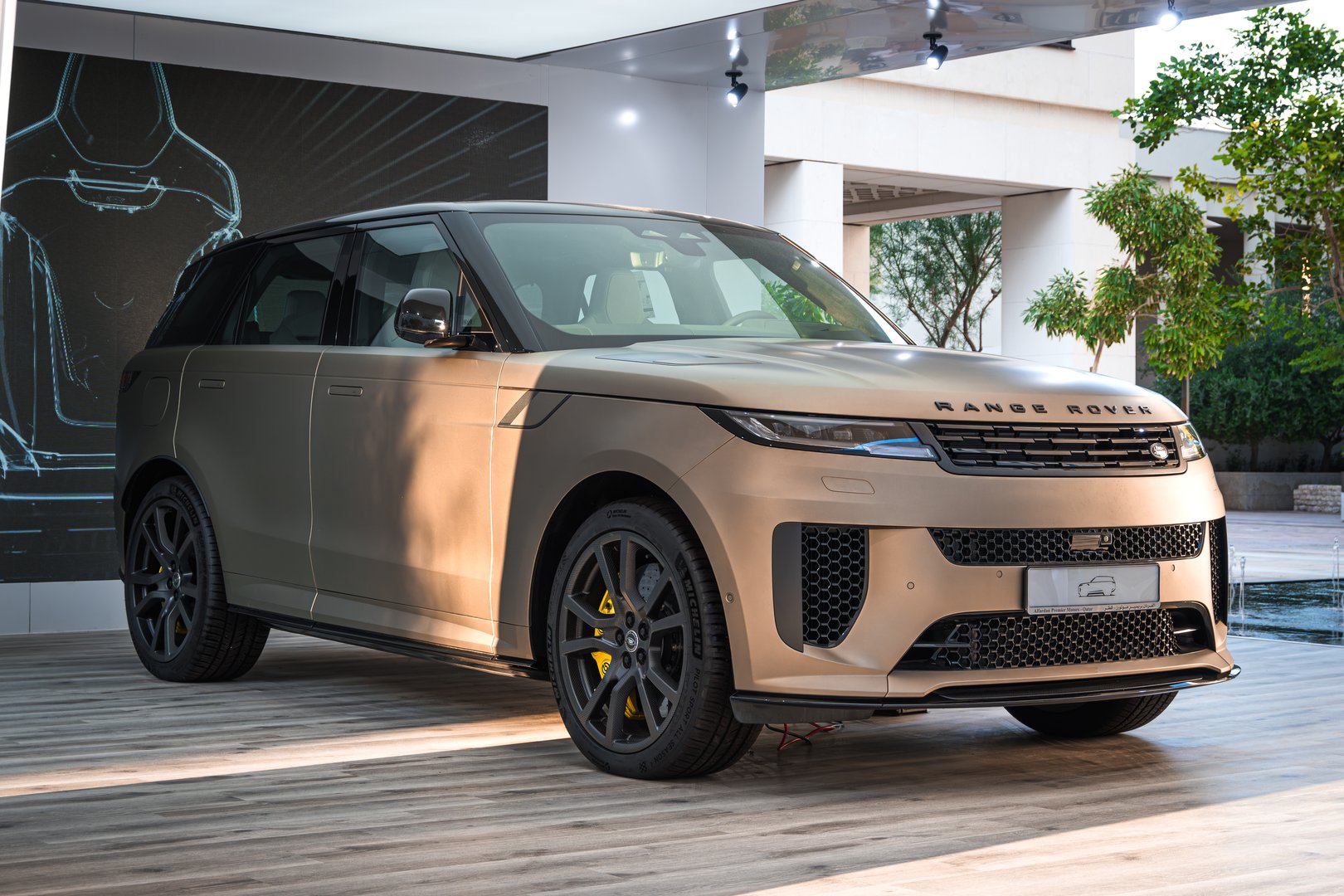 Doha, Qatar - November 15, 2024:Beige colored luxury range rover brand SUV on display in the Mashreb area in Doha Qatar