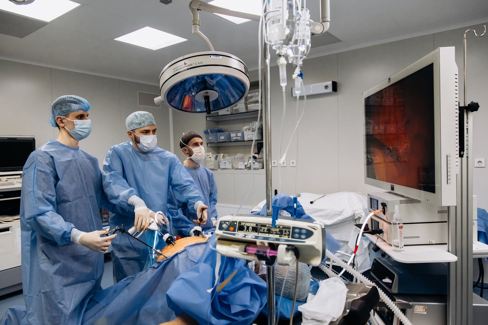 Professional surgeons in the operating room. Instrument for laparoscopic surgery. A surgeon performs laparoscopic gastric surgery in the operating room.