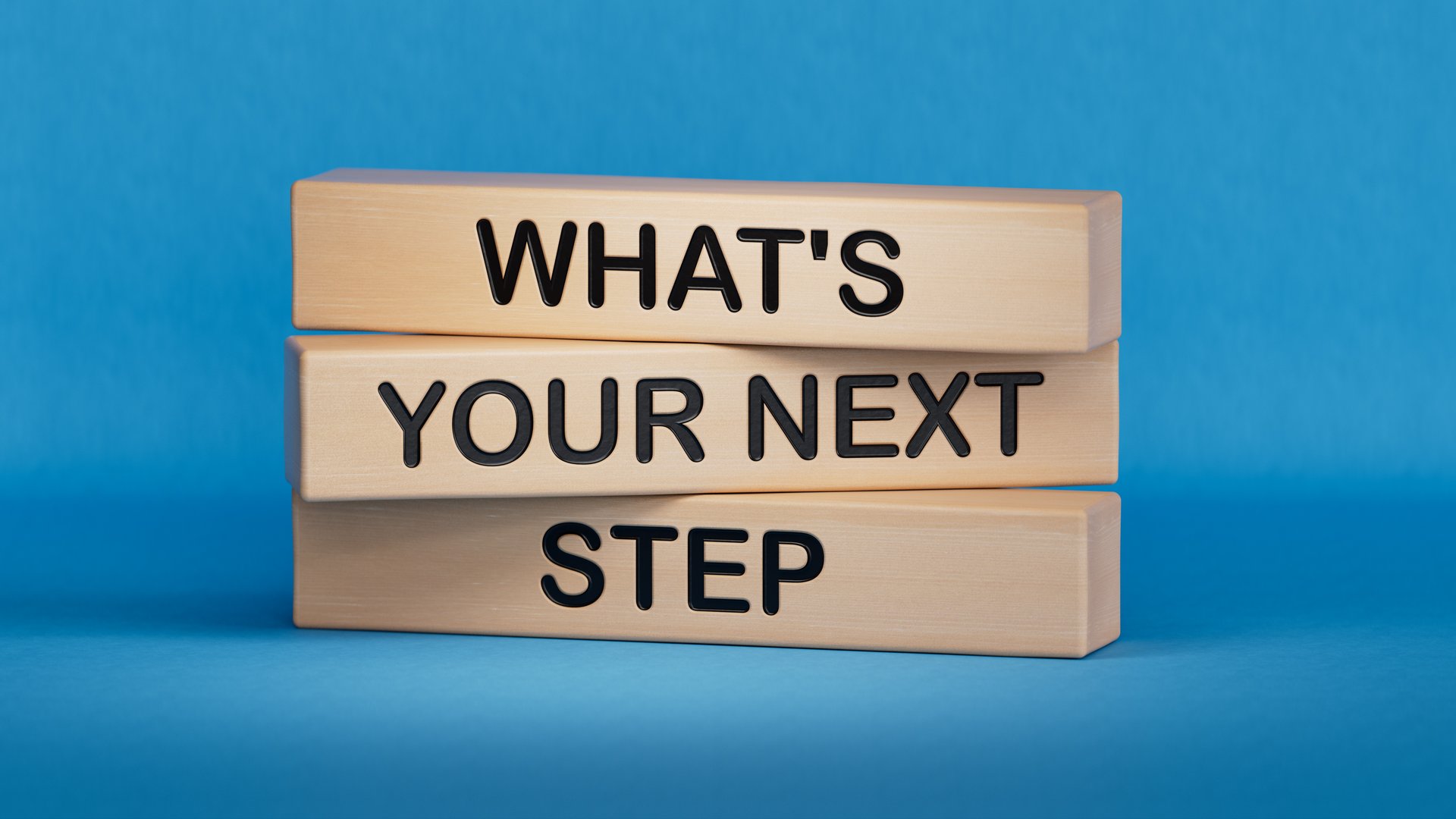 What is your next step? symbol.words What is your next step? Business concept. Wooden cube blocks. Copy space.3D rendering on blue background.