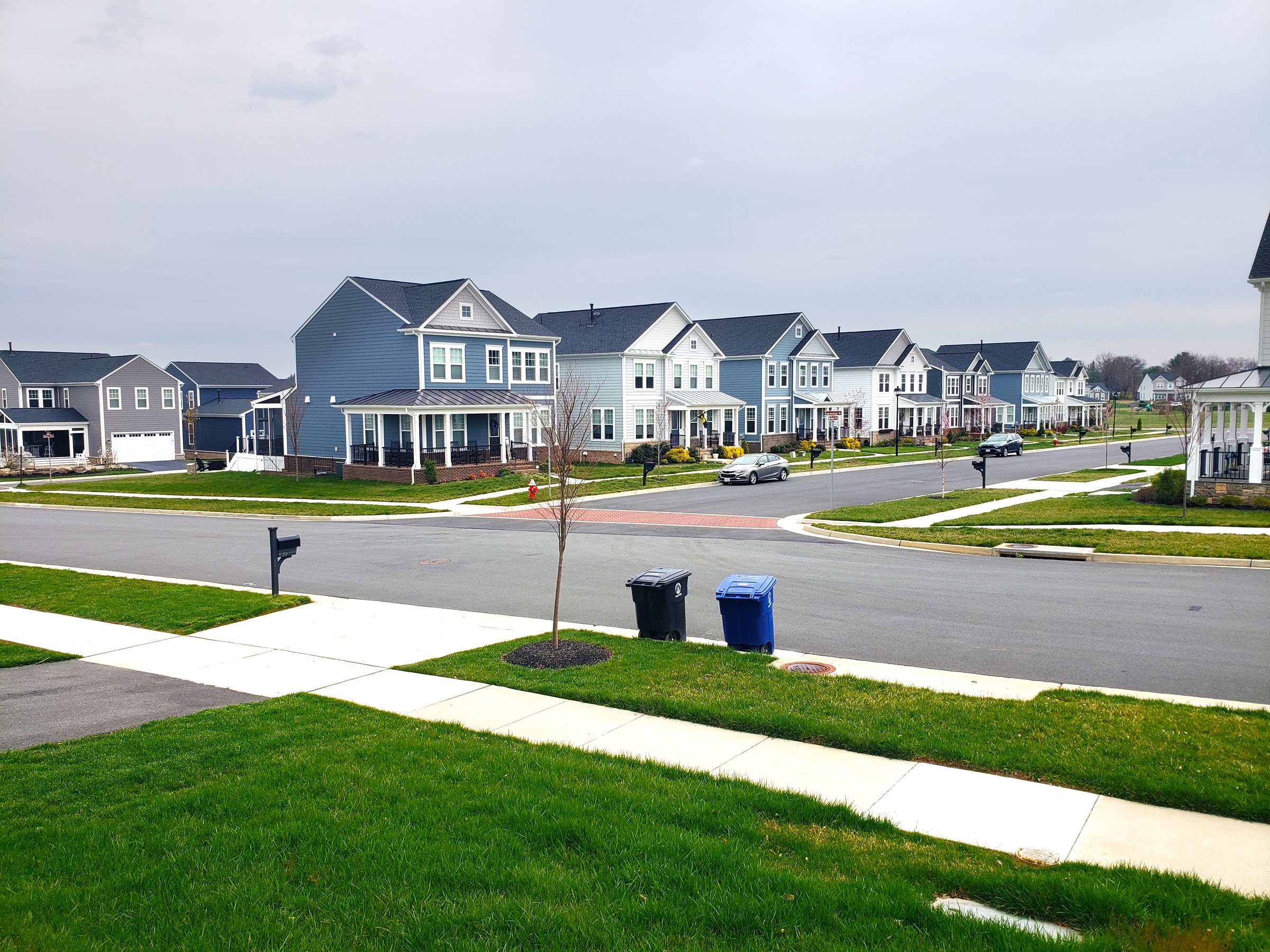row of residential homes in the suburbs. Concept of real estate development, the housing market, and homeownership.