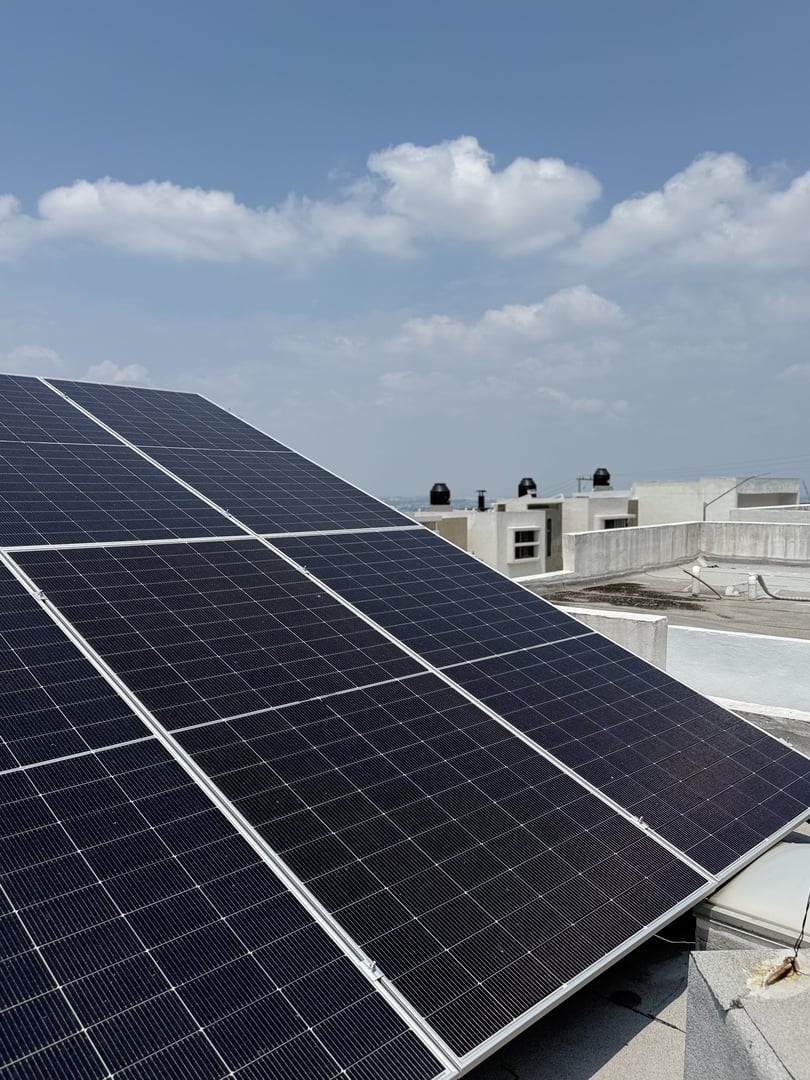 Solar home battery and inverter on a house wall