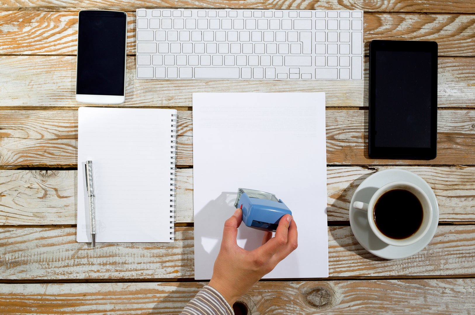 Female hand stamping document, working at office