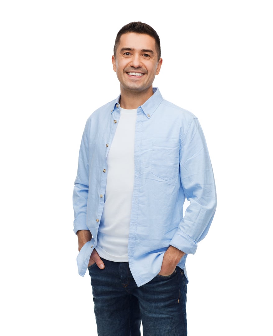 happiness and people concept - smiling man with hands in pockets