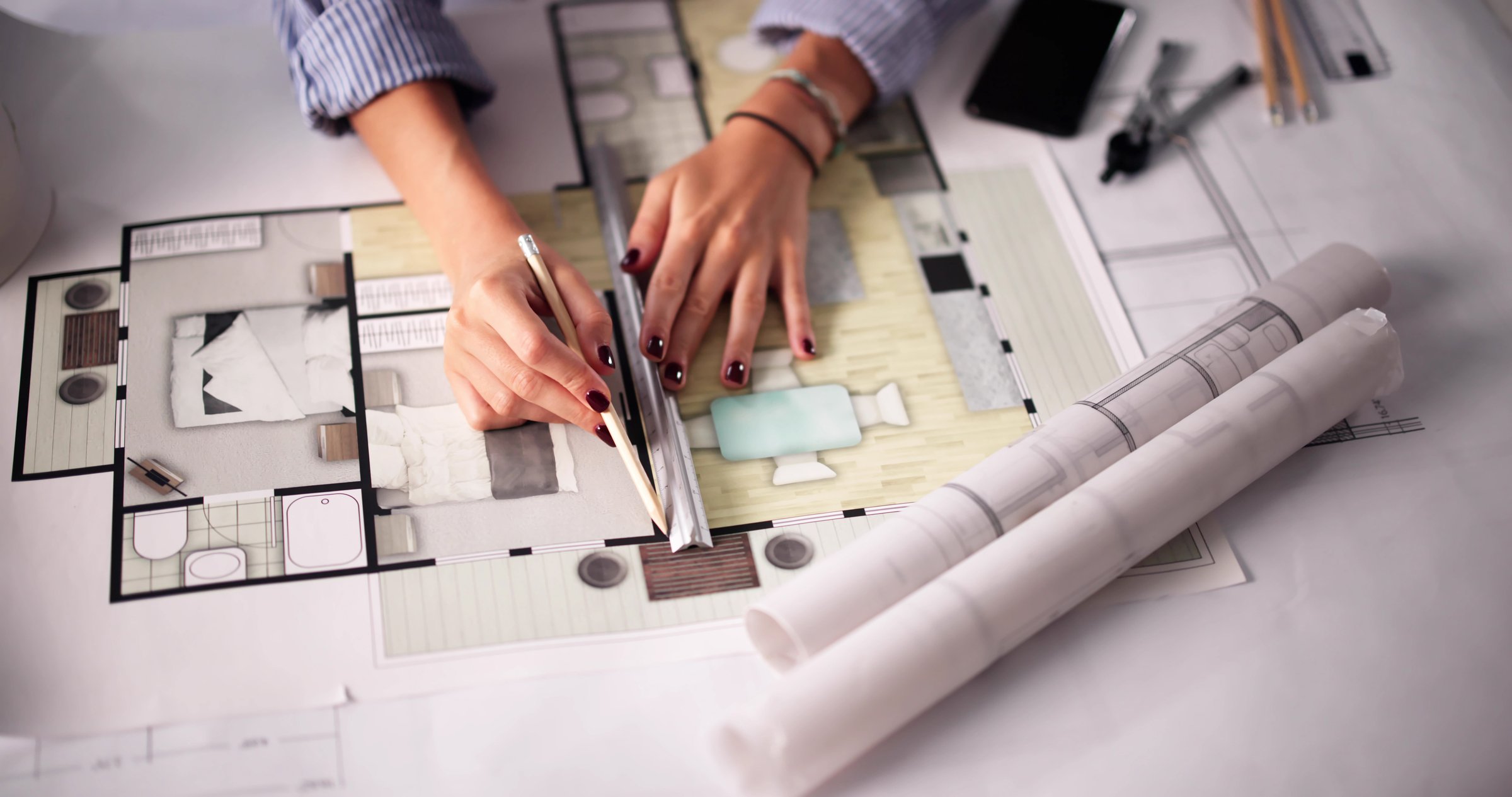 Female Architect Designing CCTV Security Alarm System Plans For Construction Project.