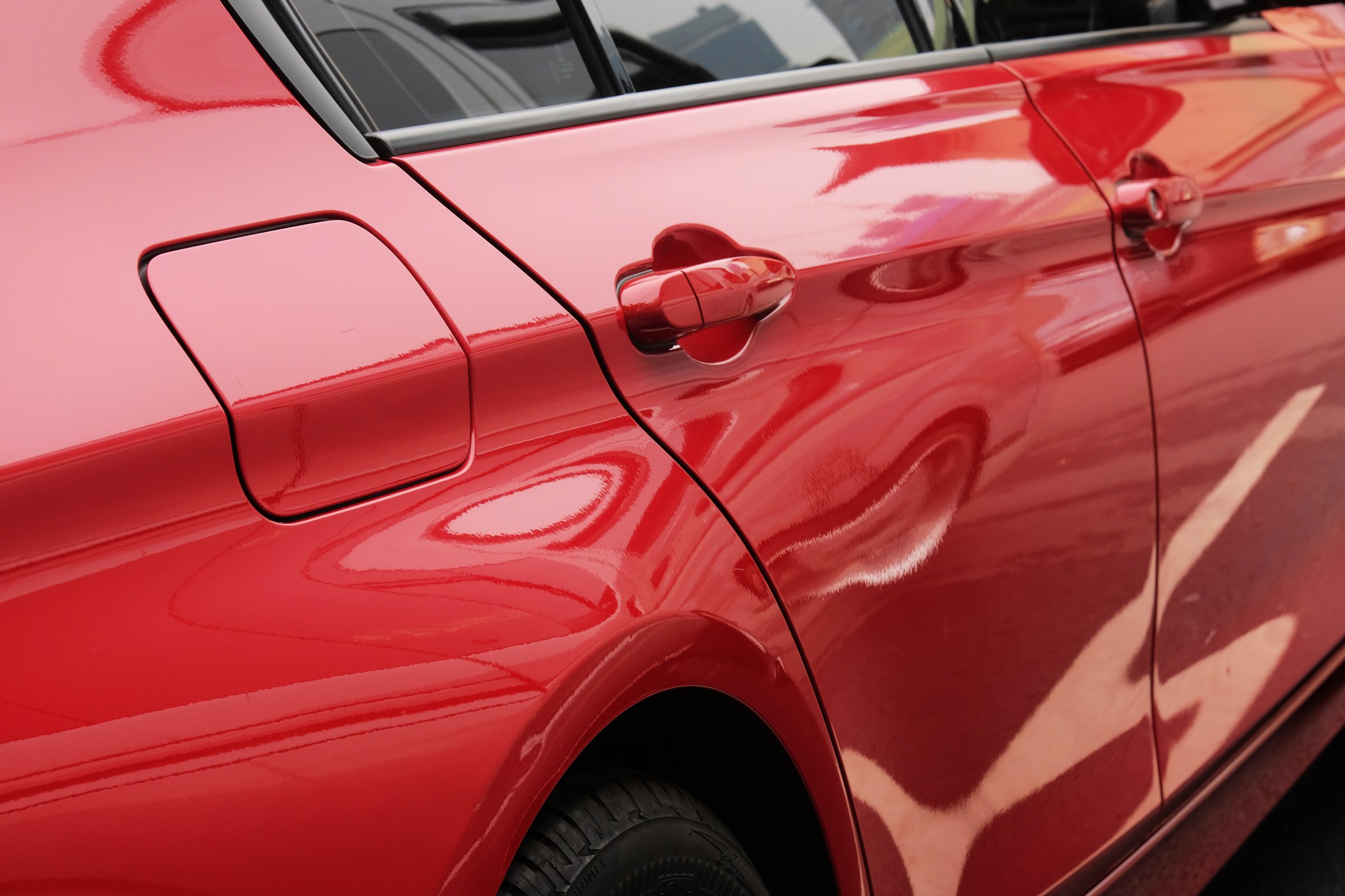 reflect of car and abstract form on metal
