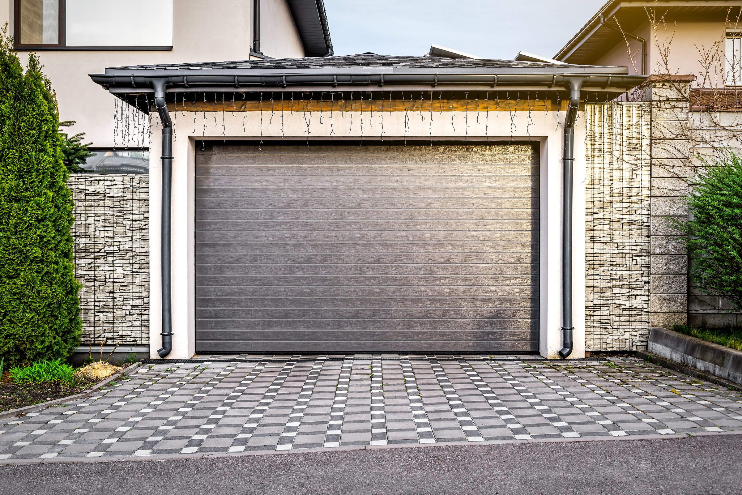 Garage with brown automatic door for one car. Transportation theme