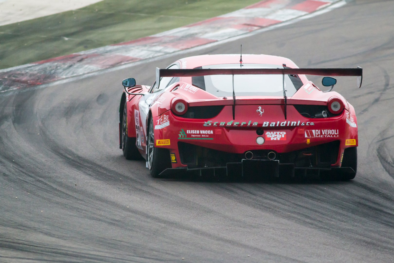 Imola, Italy - October 11, 2014: A Ferrari 458 Italia Gt3 of Baldini 27 Network Srl team, driven By Giammaria Raffaele (Ita) and CasÃ¨ Lorenzo (Ita),  the C.I. Gran Turismo car racing.