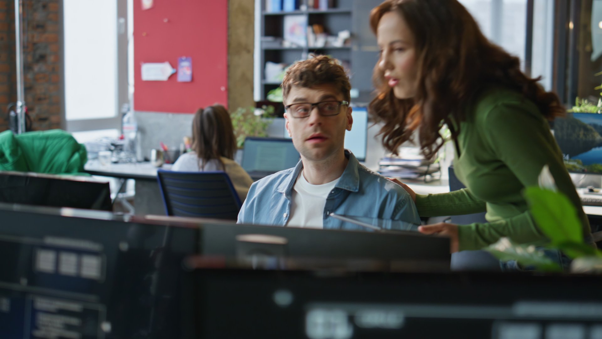 Smiling businesswoman checking trainee work in design agency closeup. Focused colleagues discussing creative project result looking computer. Happy woman boss satisfied by subordinate ideas in office